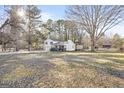 Exterior shot of home on lot, showcasing home, yard, shed and deck at 916 Marshall Fuller Rd, Dallas, GA 30157