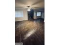Bright living room with new floors and a stone fireplace at 9091 Woodgreen Way, Jonesboro, GA 30238