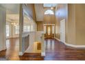 Elegant foyer with hardwood floors, high ceilings, and decorative front door at 318 Turner Cir, Mcdonough, GA 30252