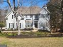 Traditional two-story home with a well-manicured front lawn and stone accents at 718 Avalon Way, Peachtree City, GA 30269