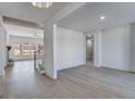 Spacious living room featuring hardwood floors, an open floor plan, and natural light at 180 Paislee Park (Lot #9 Paislee Park) Dr, Fayetteville, GA 30215