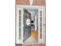 Inviting entryway with an open door revealing a view of the living room at 306 Interlake Pass, Mcdonough, GA 30252