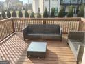 Outdoor deck featuring wicker seating and glass-topped coffee table at 4604 Mossey Dr, Stonecrest, GA 30038