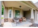 Inviting front porch with stone accents, offering a cozy seating area at 101 Deer Park Dr, Carrollton, GA 30116
