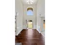 Grand foyer featuring soaring ceilings, elegant millwork, and gleaming hardwood floors at 6600 Wansfell Ct # 28, Douglasville, GA 30135