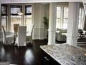 Bright dining area with large windows and an adjacent living space at 2325 Thackery Rd, Snellville, GA 30078