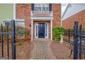 Attractive red brick townhome with welcoming front door and meticulously maintained landscaping at 498 N Jeff Davis Dr, Fayetteville, GA 30214