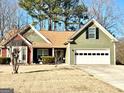 Well-maintained one-story home with a two-car garage and a traditional, inviting entrance at 222 Sandstone Dr, Hampton, GA 30228