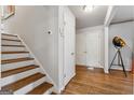 Inviting entryway with hardwood floors, white trim, neutral walls and stairs to the upper level at 3216 Pheasant Dr, Decatur, GA 30034