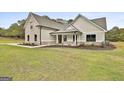 Charming home featuring a manicured lawn and well-maintained landscaping at 110 Warren Way, Fayetteville, GA 30215