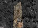 Aerial view of the home and property, showcasing the surrounding trees at 150 Grove Creek Dr, Locust Grove, GA 30248