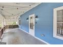 Inviting porch with string lights, outdoor lights and swing at 1616 Park Ne St, Conyers, GA 30012