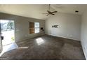 Spacious living room with ample natural light streaming in through the front door at 133 Dove Lndg, Social Circle, GA 30025