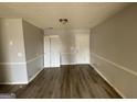 Bright and airy living room space boasting a sleek ceiling light at 133 Dove Lndg, Social Circle, GA 30025