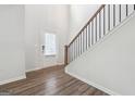 Inviting foyer with hardwood floors, a staircase, and a storm door floods the space with natural light at 604 Clark Lake Estates Dr, Grayson, GA 30017