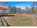 Spacious backyard with wood fencing providing privacy and a pastoral feel at 5700 Mount Zion Rd, Waco, GA 30182