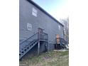 Two-story home featuring stairs to the door and painted brick at 1973 Jones Nw Ave, Atlanta, GA 30318