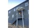 Two-story home featuring multiple windows, gray siding and porch at 1973 Jones Nw Ave, Atlanta, GA 30318