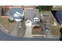 Aerial view of a home showcasing its location, landscaping, and proximity to neighboring houses at 312 Villa Place Ct, Tucker, GA 30084