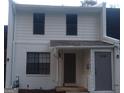 Exterior of the townhome with a white brick facade and modern windows at 746 Dunaire Way, Jonesboro, GA 30238