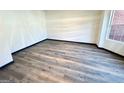 Spacious living room featuring new wood flooring and neutral paint, perfect for entertaining or relaxing at 6159 Sable Fox Dr, Riverdale, GA 30296