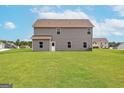 Expansive backyard featuring a lush green lawn, ideal for outdoor activities and relaxation at 1037 Claas Way, Locust Grove, GA 30248
