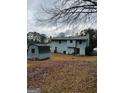 An expansive backyard featuring a storage shed with a shed, ideal for outdoor activities at 5865 Vernier Dr, Atlanta, GA 30349