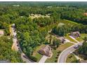 A lovely home in a serene, wooded area with a pond nearby, offering privacy and natural beauty at 105 Dockstreet Aly, Peachtree City, GA 30269