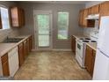 Functional kitchen with modern appliances and ample counter space at 165 Lakeside Pt, Covington, GA 30016