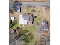 Aerial view of property including the main house and multiple outbuildings at 123 Cowan Rd, Covington, GA 30016