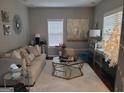 Comfortable living room with lots of natural light, neutral colors, and decorative accents at 4006 Asheville Ct, Buford, GA 30519