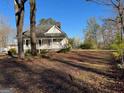 Inviting single-story home with classic architecture, set on a spacious lot with mature trees and shade at 2680 Noahs Ark Rd, Jonesboro, GA 30236