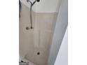 A standard stall shower with built-in seats and a shower head at 6160 Great Oaks Dr, Lithonia, GA 30058