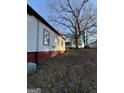 Angle view of home showcasing siding, large lot and backyard at 18 Laurel St, Covington, GA 30014