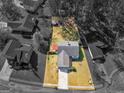 Aerial view of a home with a spacious backyard, surrounded by mature trees at 255 Brandon Ridge Cir, Stockbridge, GA 30281