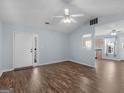 Bright living room featuring wood floors, ceiling fan, and open layout at 255 Brandon Ridge Cir, Stockbridge, GA 30281