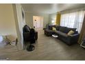 Spacious living room with hardwood floors and modern furniture at 6861 Wendy Jean Dr, Morrow, GA 30260