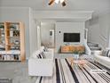 Bright living room with neutral walls, plush carpet, and modern decor at 483 Fairlane Nw Cir, Atlanta, GA 30331
