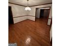 Dining room with hardwood floors and traditional chandelier, perfect for gatherings at 105 Windridge Dr, Fayetteville, GA 30215