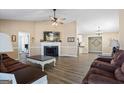 Spacious living room with a fireplace, hardwood floors, and neutral paint at 850 Coan Dr, Locust Grove, GA 30248