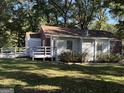 A charming home with a ramp for easy access to the rear entrance and a large yard at 718 N. Hairston Rd, Stone Mountain, GA 30083