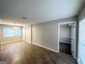 Spacious living room with hardwood floors, ample natural light, and a view into adjacent rooms at 3395 Longleaf Dr, Decatur, GA 30032