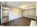 Cozy living room featuring new vinyl floors, a fireplace, and an open doorway leading to other rooms at 3395 Longleaf Dr, Decatur, GA 30032