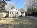 Classic brick home with attached carport and mature trees, blending comfort and convenience at 2191 Tilson Cir, Decatur, GA 30032