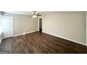 Bright, freshly painted living room featuring modern laminate flooring and new ceiling fan for a comfortable ambiance at 2191 Tilson Cir, Decatur, GA 30032