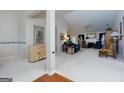 Spacious living room boasts an open layout and a cozy fireplace for gatherings at 4030 Cresent Walk Ne Ln, Suwanee, GA 30024
