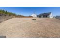 Expansive back yard with newly planted tree and privacy fence, perfect for outdoor activities at 104 Conway St, Peachtree City, GA 30269