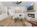 Inviting living room with modern fireplace, ceiling fan, and stylish decor at 223 Ivey Ter # 34, Temple, GA 30179