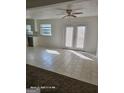 Open living area featuring tiled floors, white walls and natural light at 11187 Shannon Cir, Hampton, GA 30228