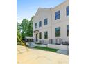 Charming two-story home with a white brick facade and well-manicured landscaping at 2443 Sycamore Nw Rd, Atlanta, GA 30318